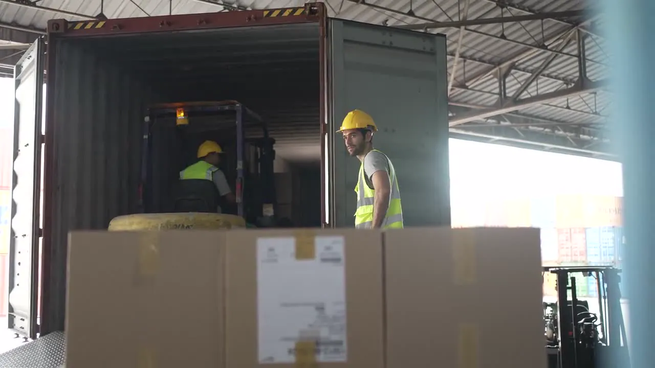 A crew working freight at a loading dock